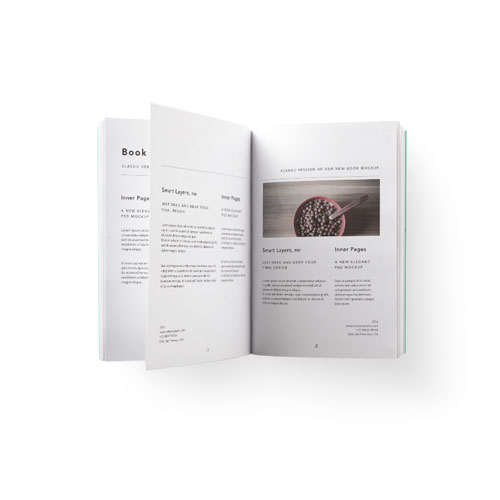 open perfect bound book on white background